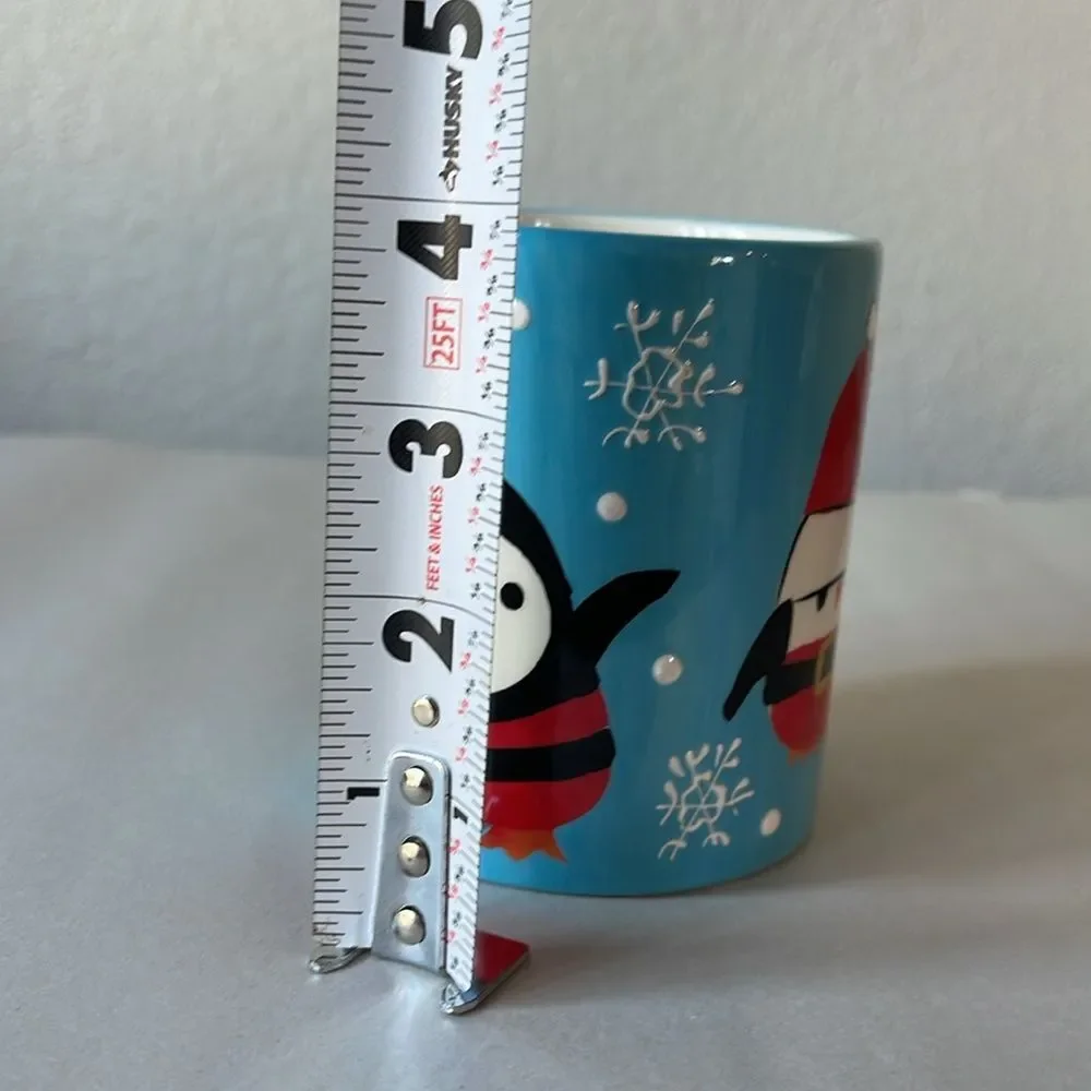 Pier 1 Penguin in Santa Outfit Blue Coffee Mug.